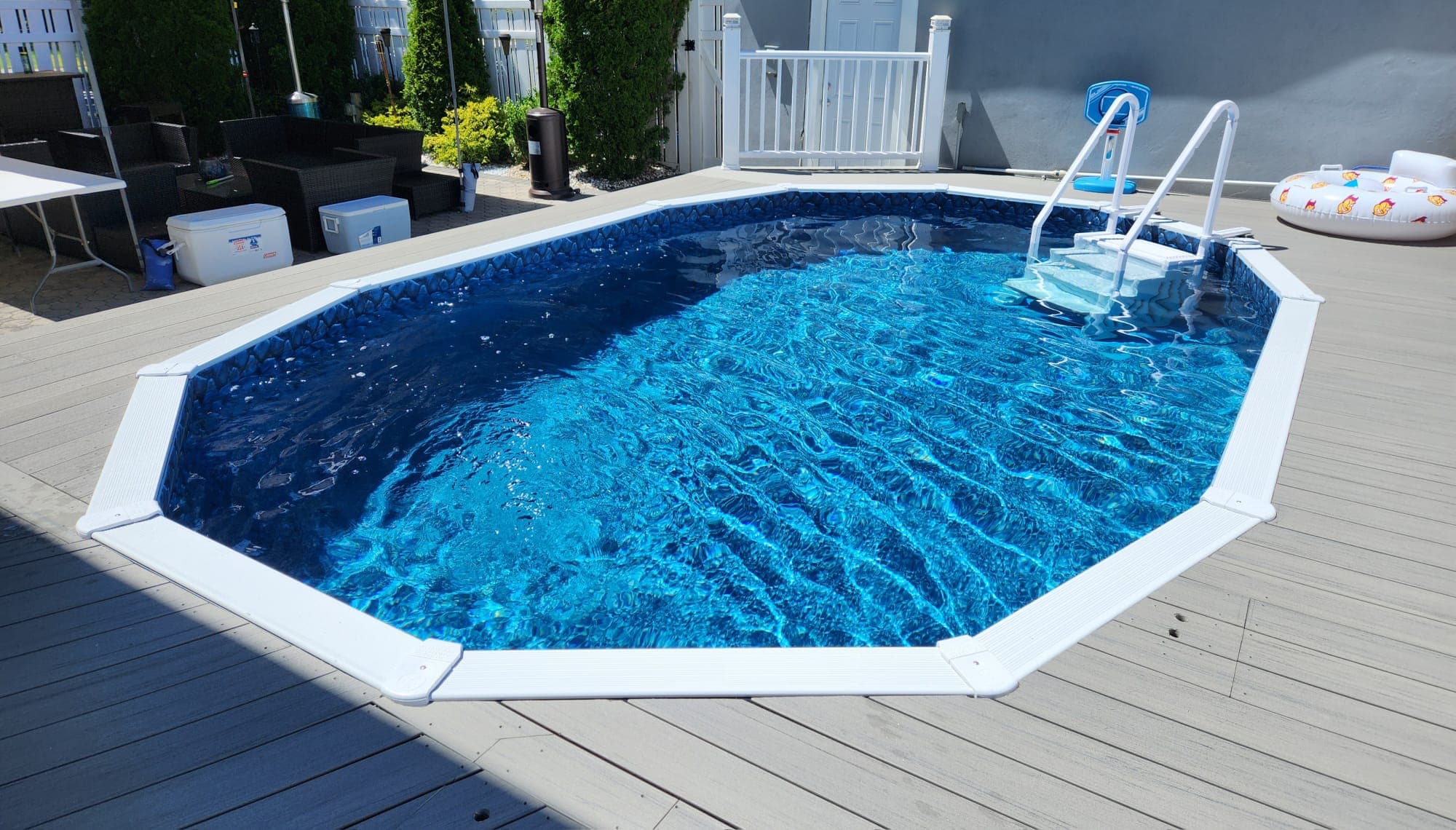 Aquasport 52 semi-inground pool installed in a backyard deck